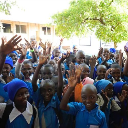 Kenya, Happy African children waving at the camera