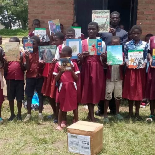 Kenya, African children with their library books