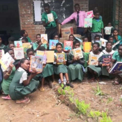 Kenya, African children with their library books